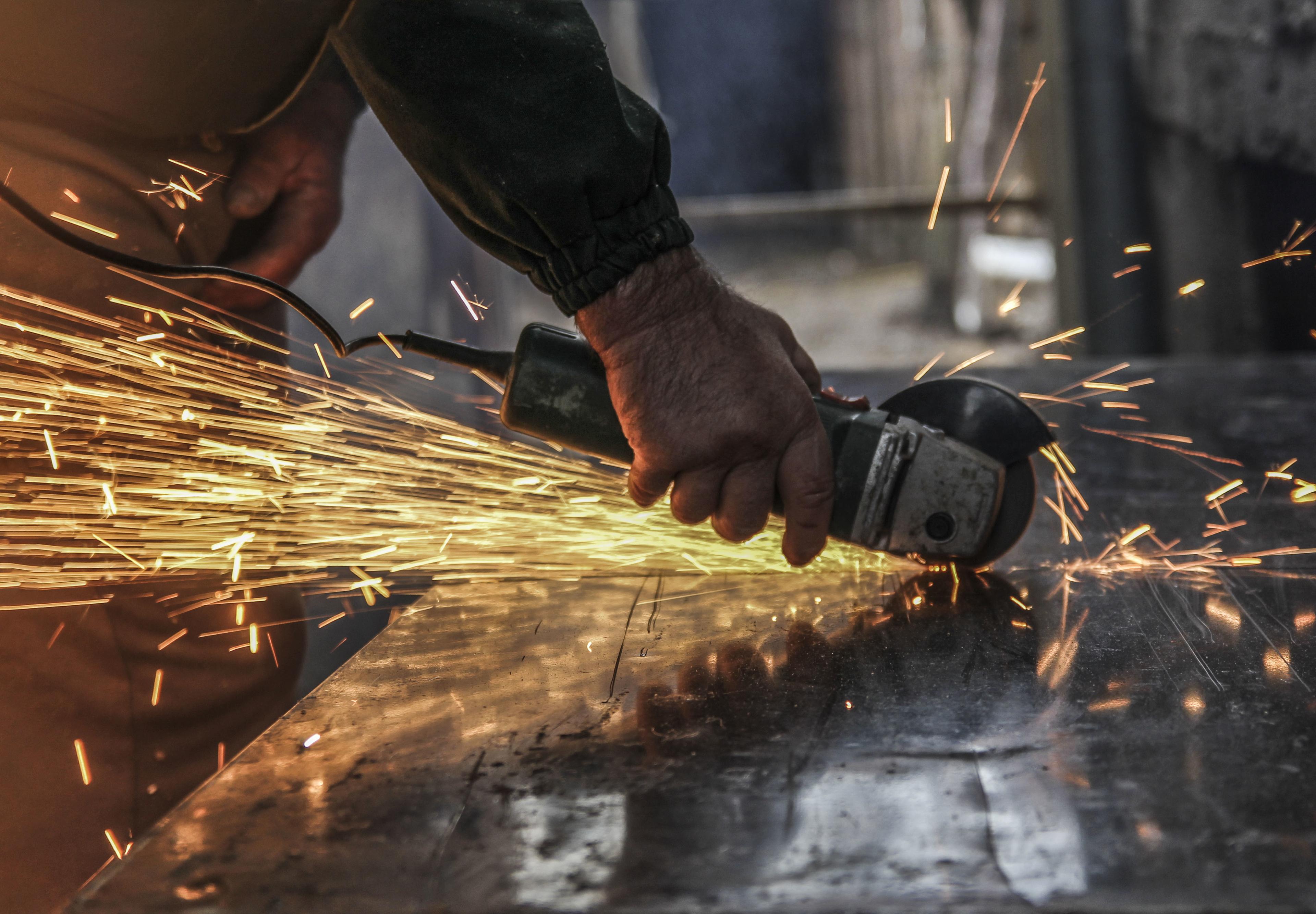 Angle grinding sparks during metal fabrication work